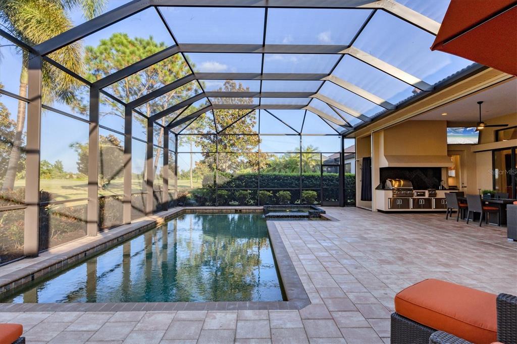 14519 Leopard Creek Place Lakewood Ranch, FL 34202 - Photo 40 of 56 a view of a chairs and table in the patio