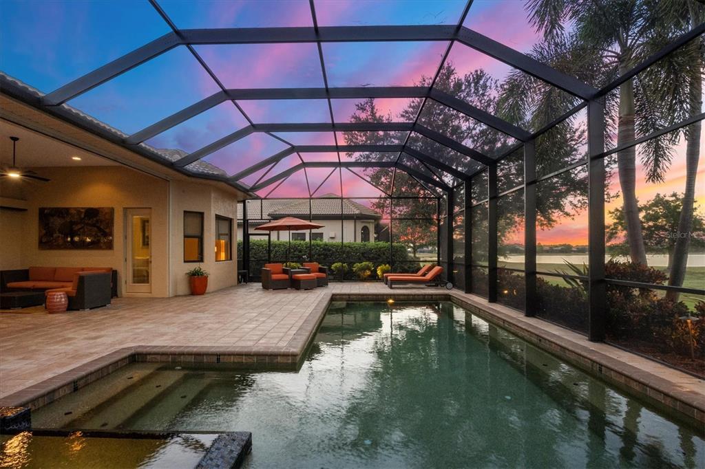14519 Leopard Creek Place Lakewood Ranch, FL 34202 - Photo 7 of 56 a view of a swimming pool with a patio