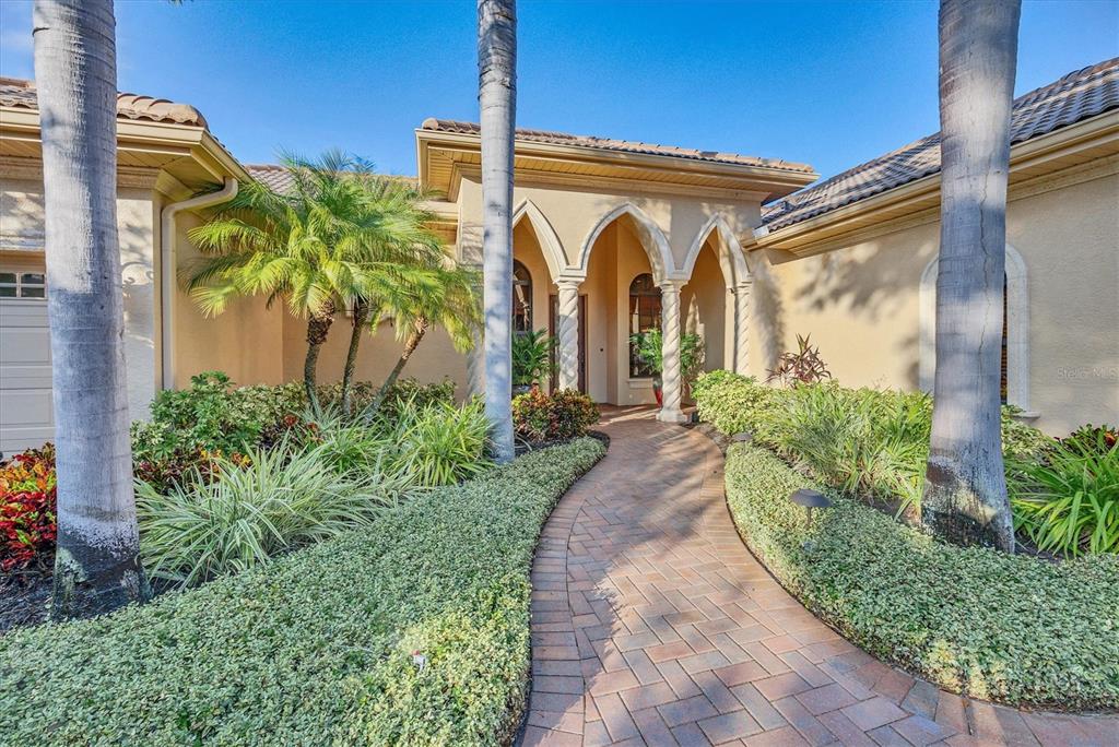 14519 Leopard Creek Place Lakewood Ranch, FL 34202 - Photo 10 of 56 a front view of a house with garden