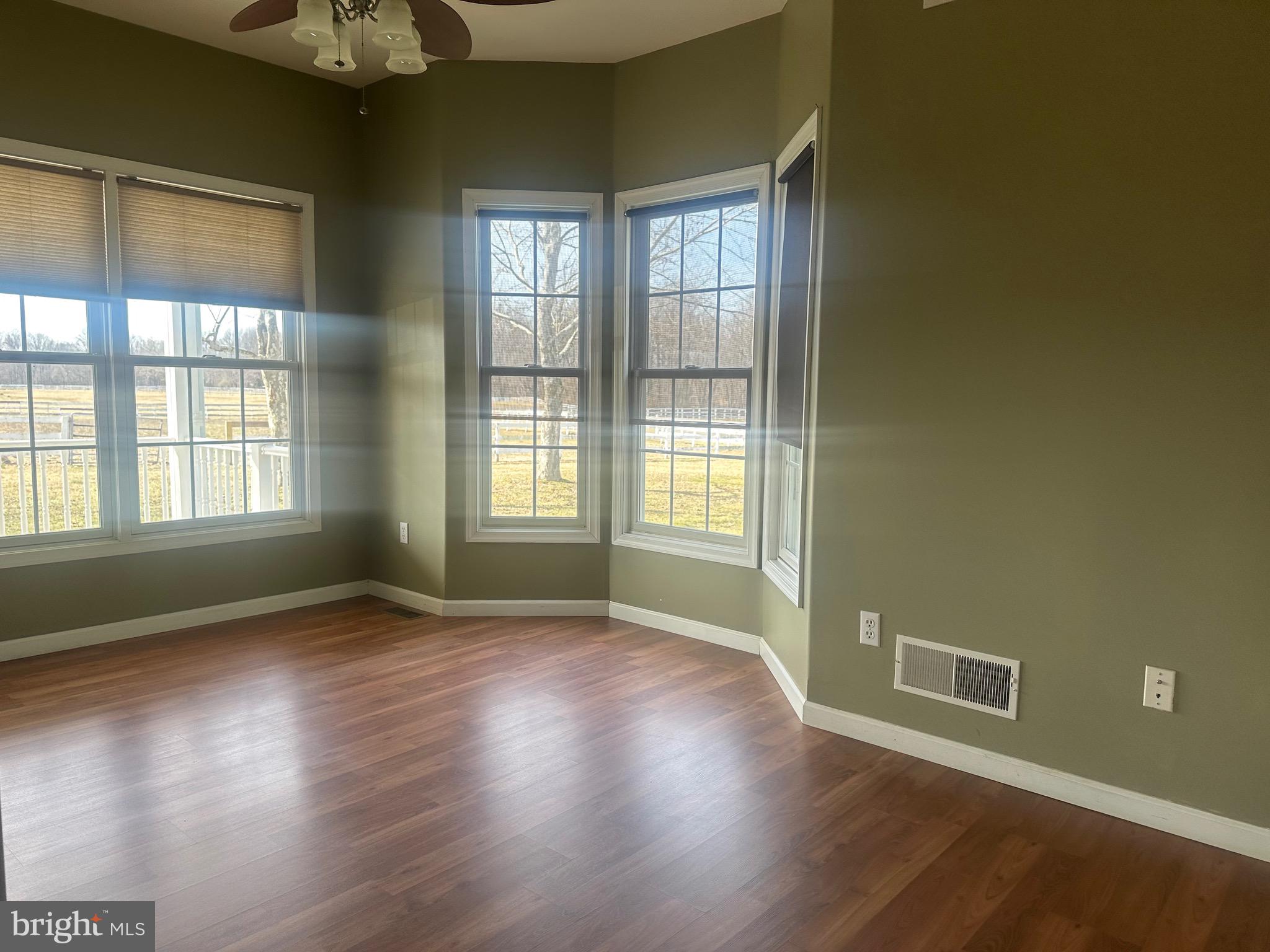 1351 Bohemia Mill Road Middletown, DE 19709 - Photo 6 of 13 an empty room with wooden floor and windows