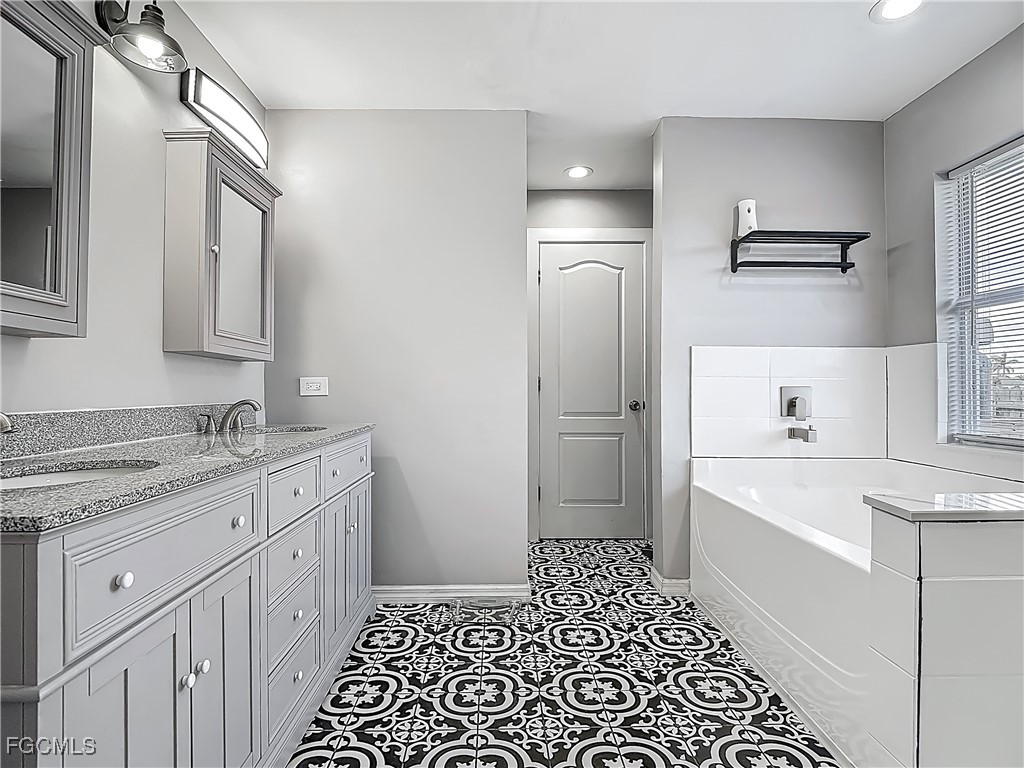 2732 Northwest 3rd Terrace Cape Coral, FL 33993 - Photo 9 of 9 a kitchen with a sink stove and refrigerator