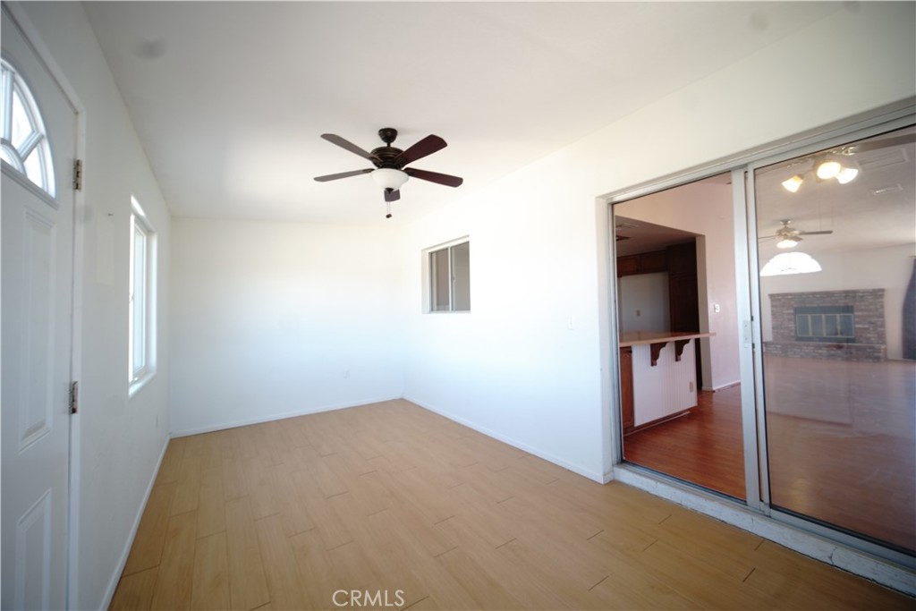 4818 Round Up Road Twentynine Palms, CA 92277 - Photo 13 of 25 wooden floor in an empty room with a window
