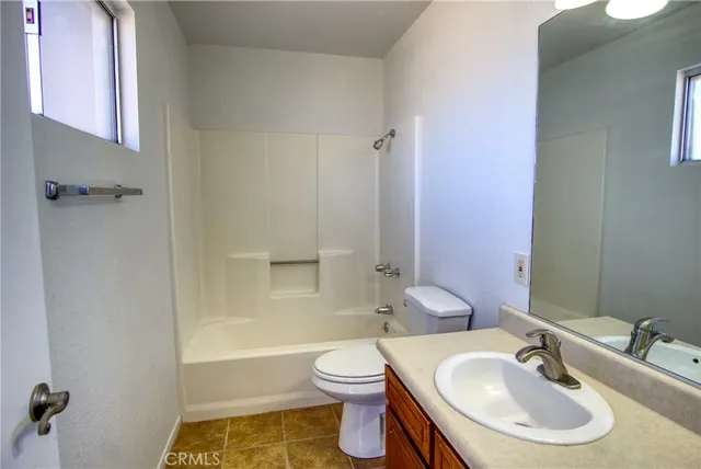 a bathroom with a sink toilet a shower and bathtub