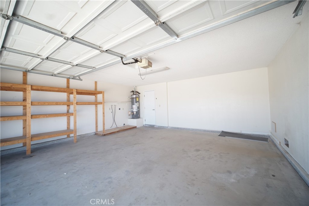 4818 Round Up Road Twentynine Palms, CA 92277 - Photo 17 of 25 a view of empty room with wooden floor