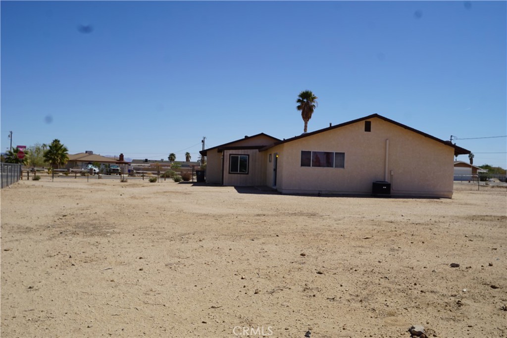 4818 Round Up Road Twentynine Palms, CA 92277 - Photo 23 of 25 a big room with wooden cabinet