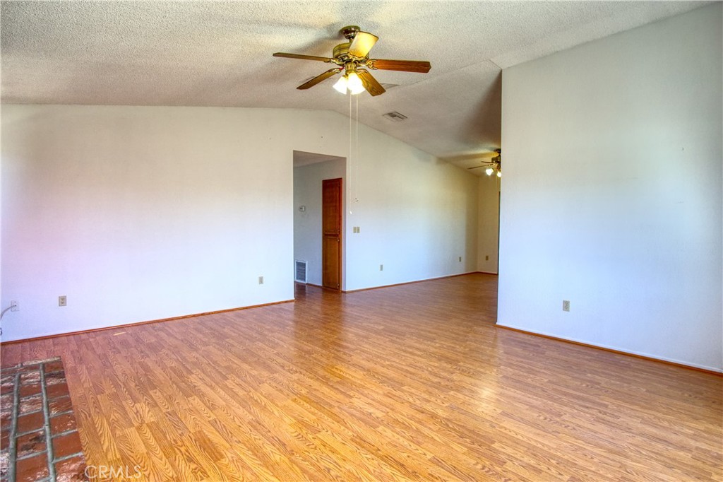 4818 Round Up Road Twentynine Palms, CA 92277 - Photo 6 of 25 wooden floor in an empty room