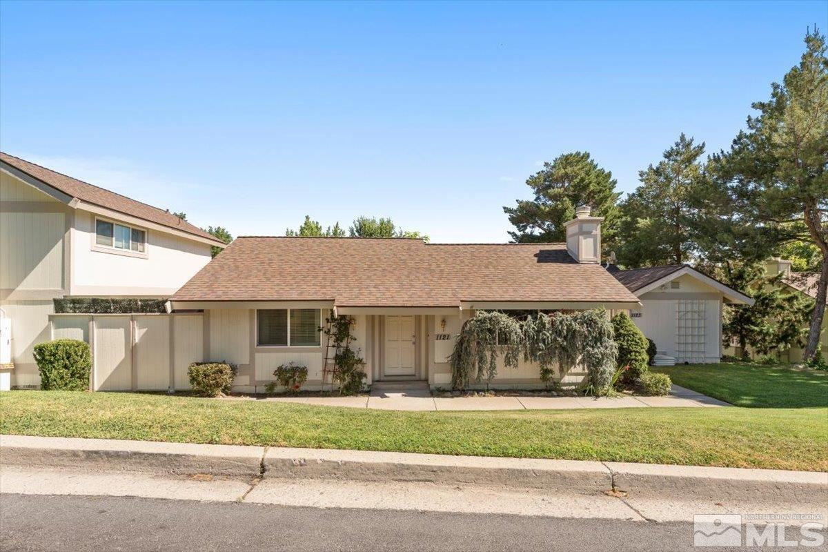 1121 Wagon Wheel Circle Reno, NV 89503 - Photo 1 of 31 a front view of a house with a yard
