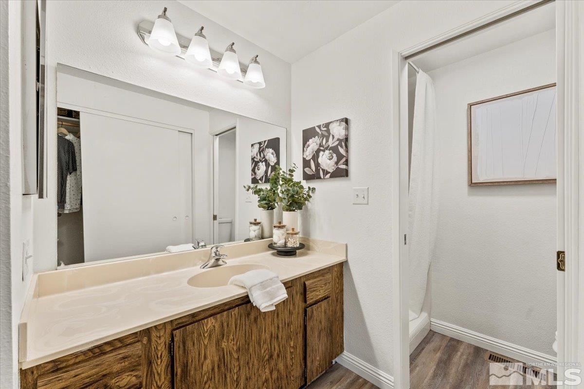 1121 Wagon Wheel Circle Reno, NV 89503 - Photo 18 of 31 a bathroom with a sink and a mirror