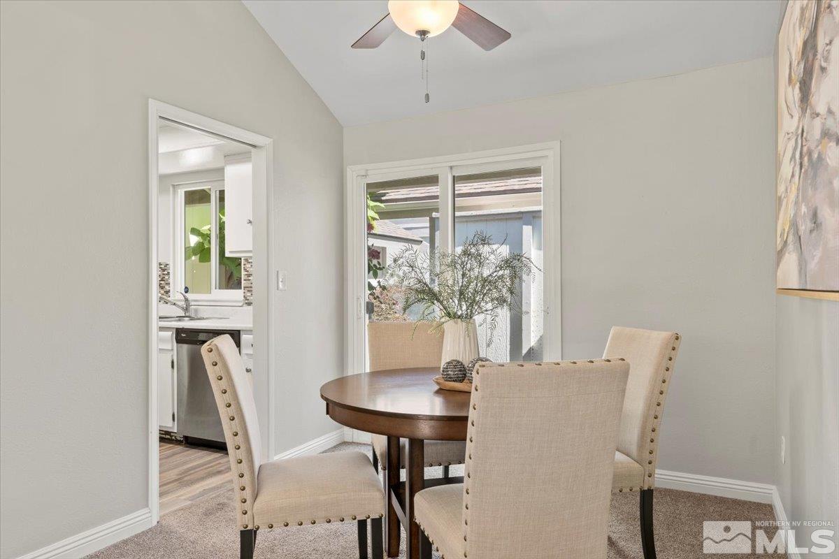1121 Wagon Wheel Circle Reno, NV 89503 - Photo 8 of 31 a view of a dining room with furniture and a chandelier