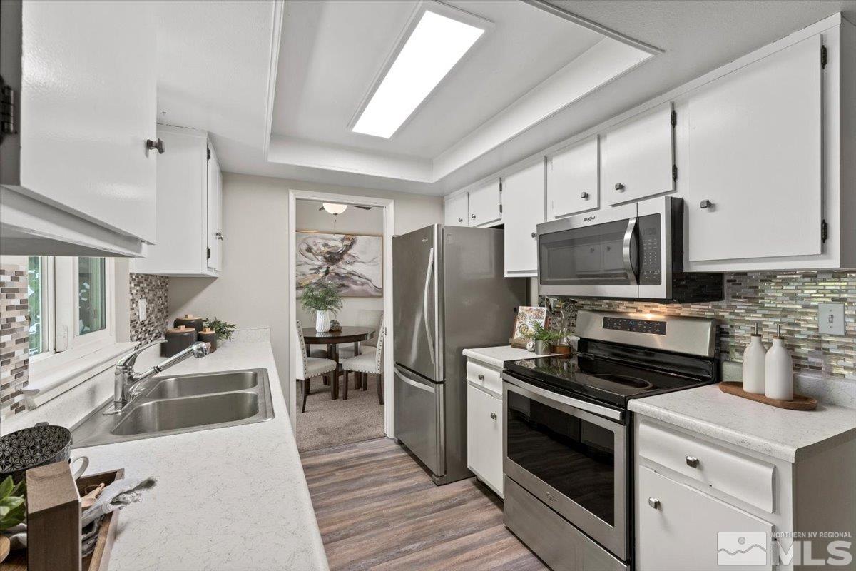 1121 Wagon Wheel Circle Reno, NV 89503 - Photo 10 of 31 a kitchen with a stove and a microwave