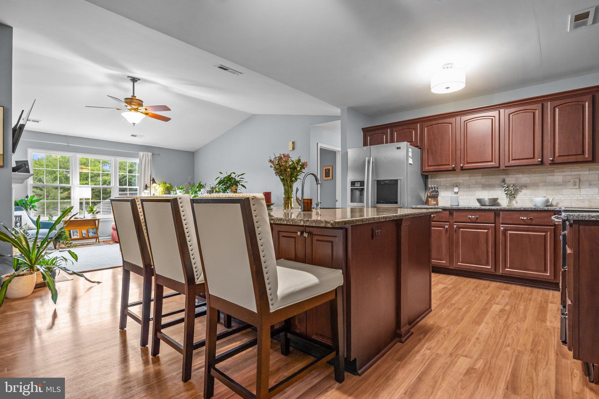 12306 Cornerstone Drive Yardley, PA 19067 - Photo 10 of 25 a kitchen with a table chairs a sink dishwasher window and cabinets