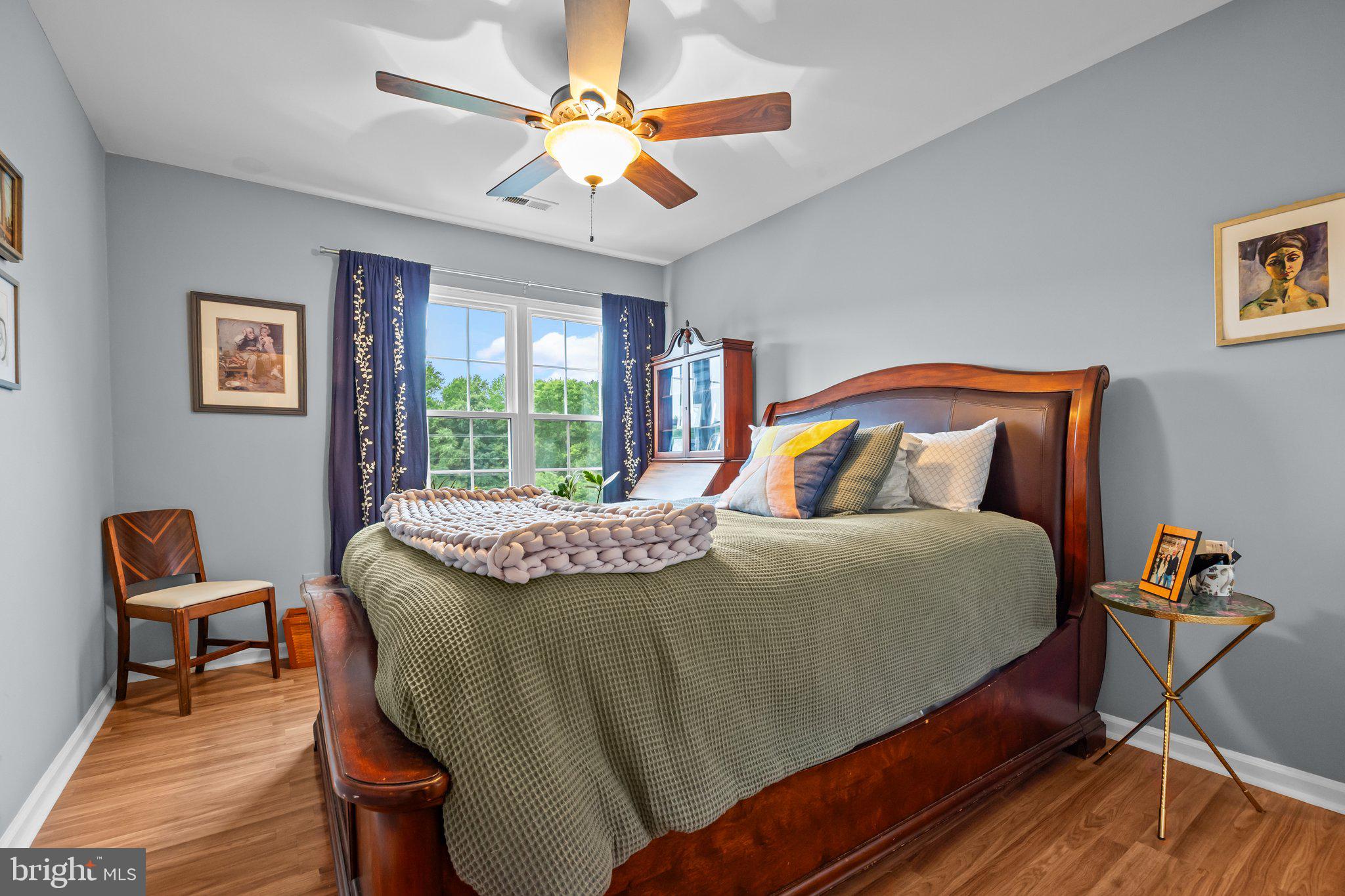 12306 Cornerstone Drive Yardley, PA 19067 - Photo 11 of 25 a bedroom with a bed a lamp and a window
