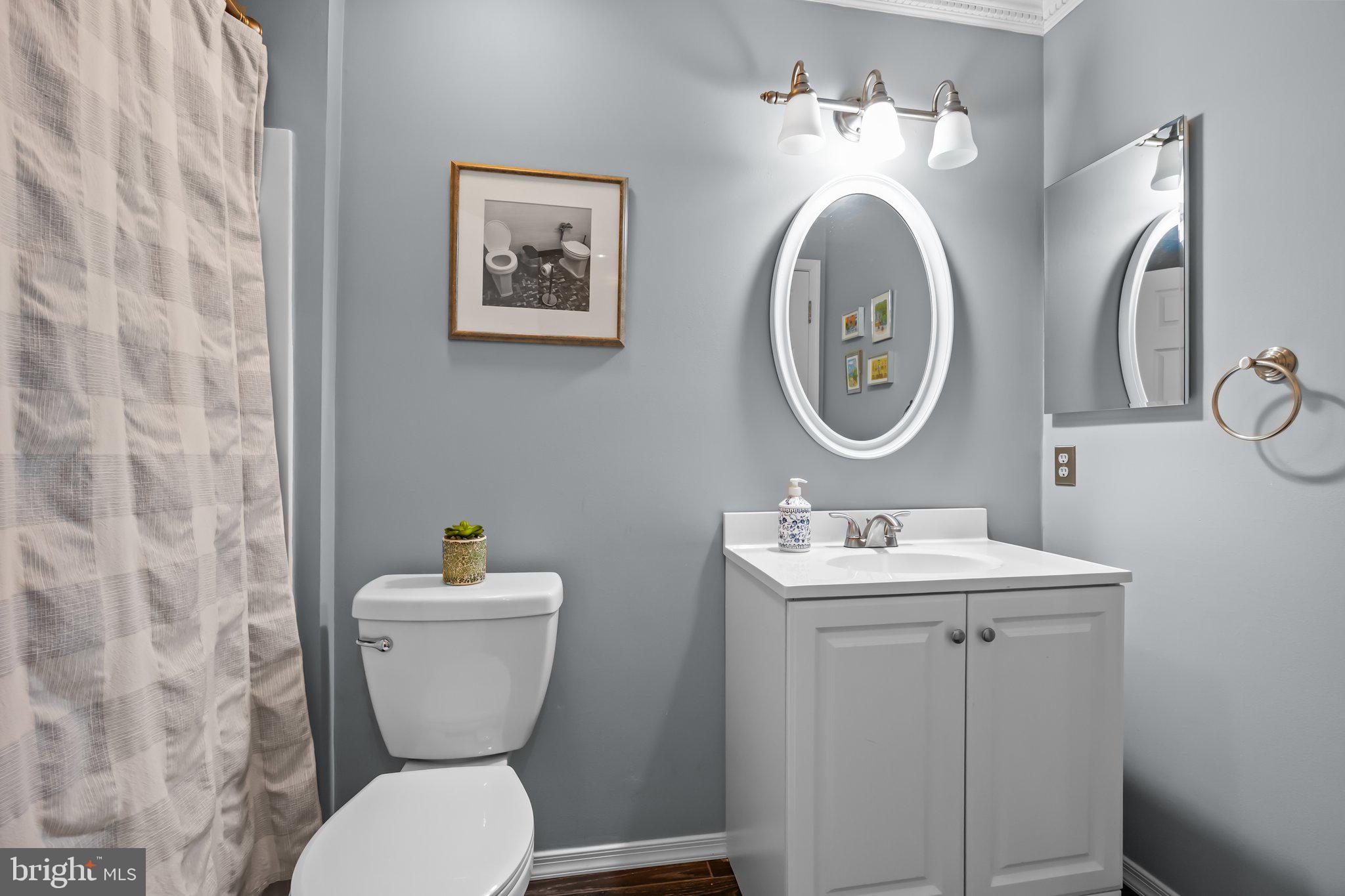 12306 Cornerstone Drive Yardley, PA 19067 - Photo 12 of 25 a bathroom with a toilet sink and mirror