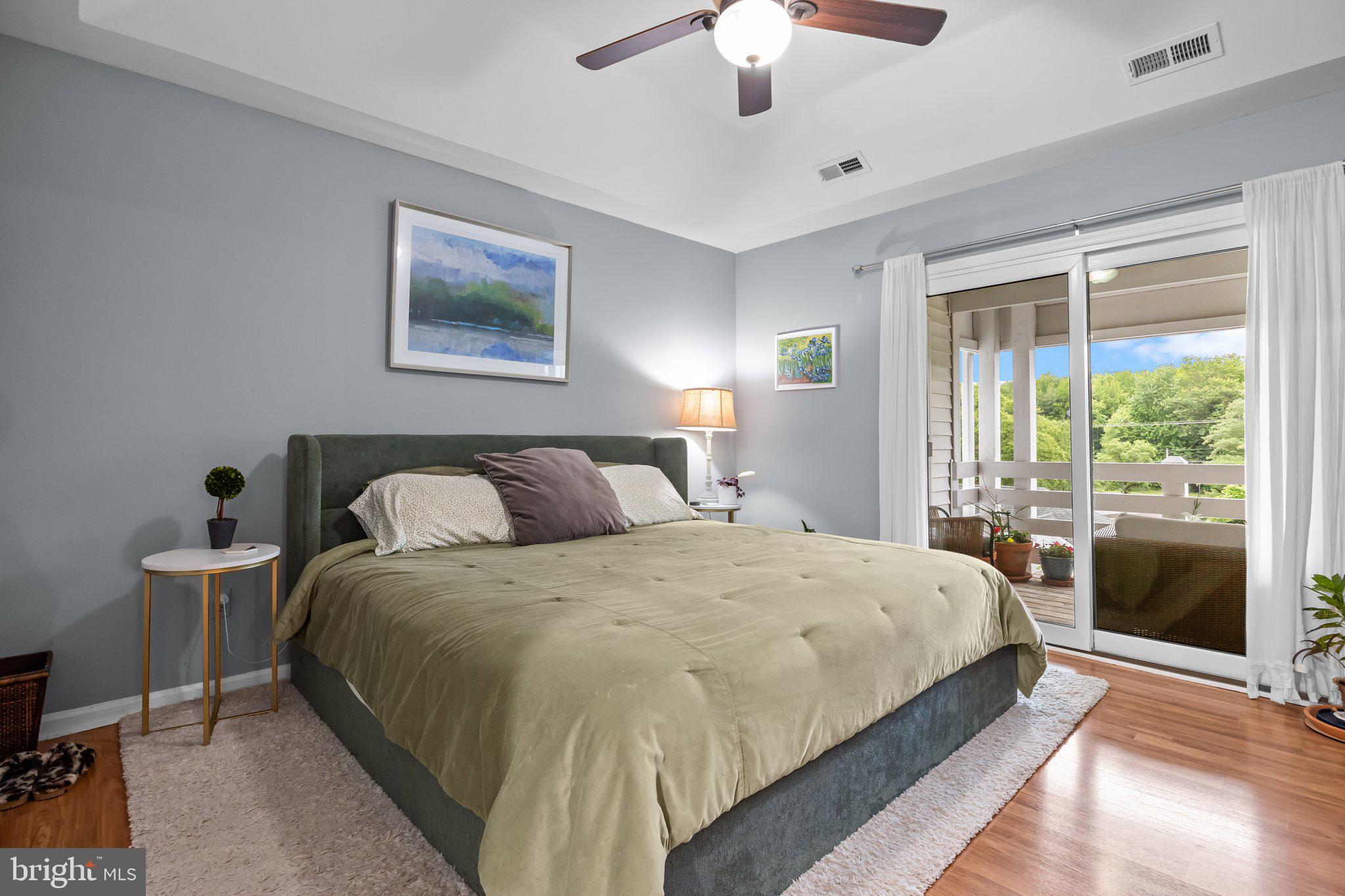 12306 Cornerstone Drive Yardley, PA 19067 - Photo 14 of 25 a bedroom with a large bed and a chandelier