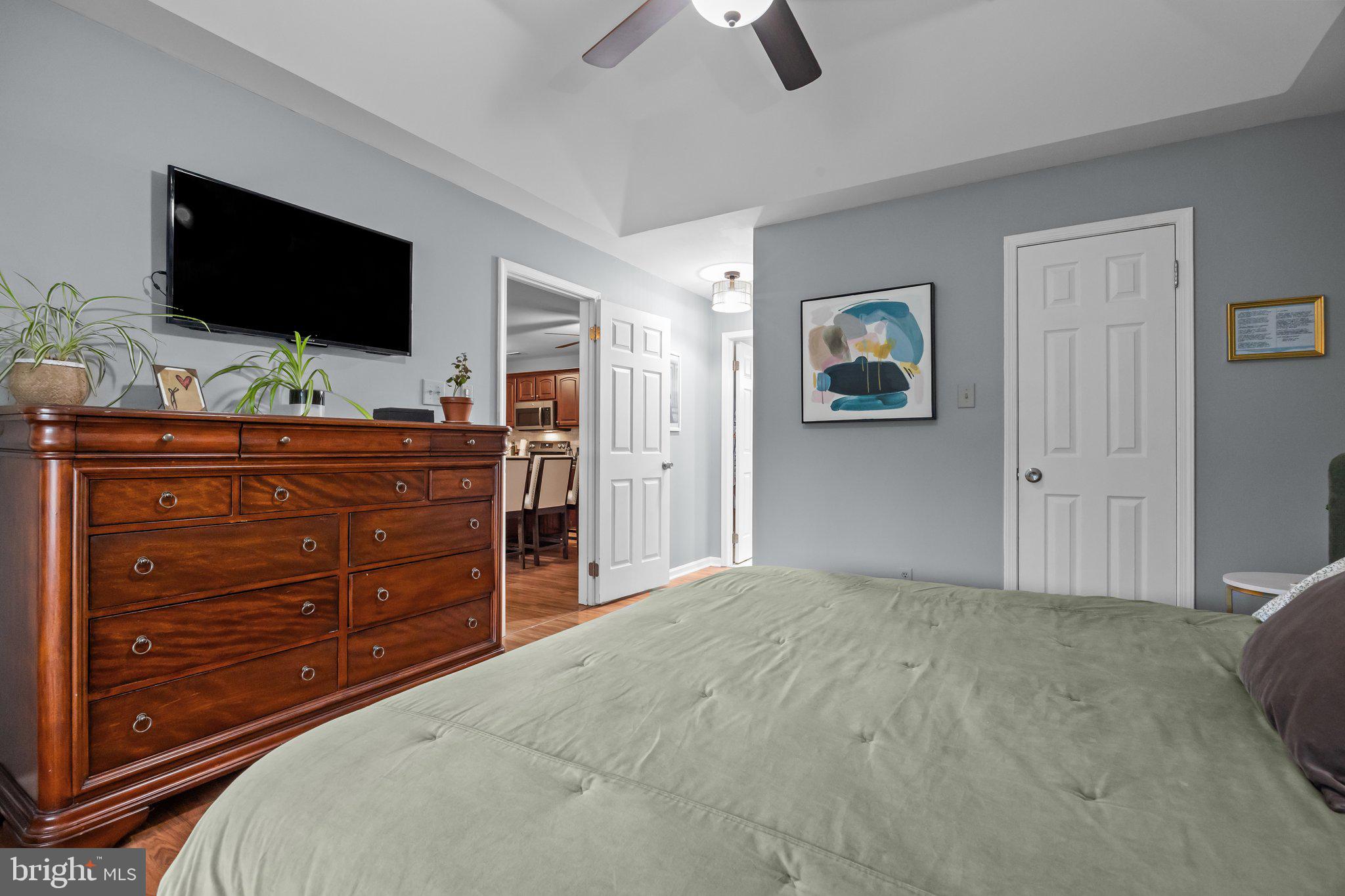 12306 Cornerstone Drive Yardley, PA 19067 - Photo 15 of 25 a bedroom with a bed and a flat screen tv