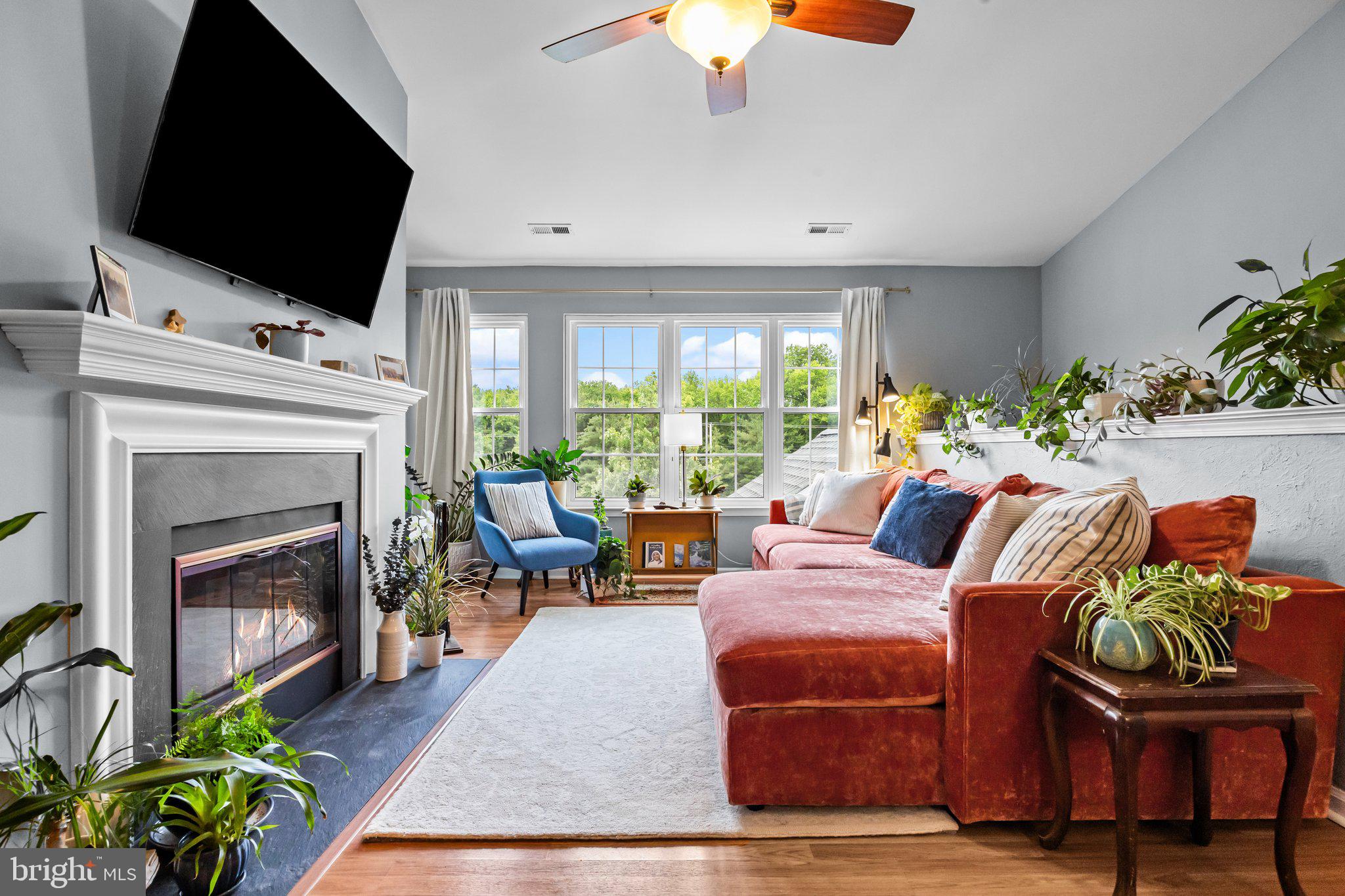 12306 Cornerstone Drive Yardley, PA 19067 - Photo 4 of 25 a living room with furniture a flat screen tv and a fireplace