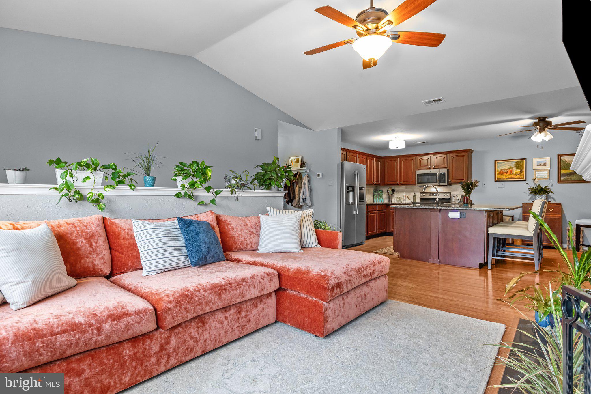 12306 Cornerstone Drive Yardley, PA 19067 - Photo 25 of 25 a living room with furniture kitchen view and a chandelier