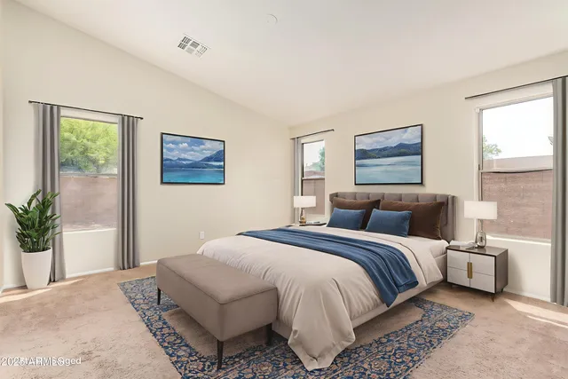 a bedroom with a large bed and a window