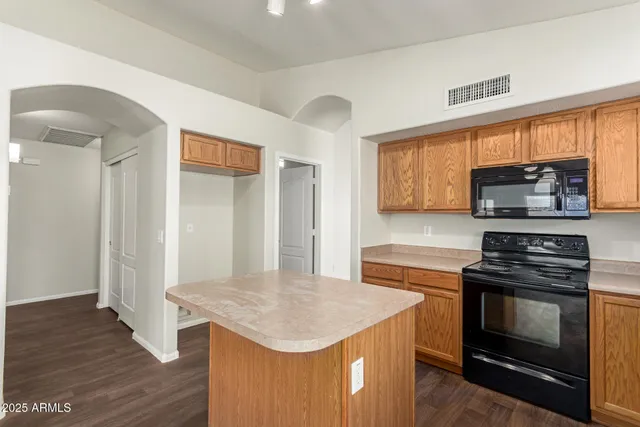 a kitchen with a stove and a microwave