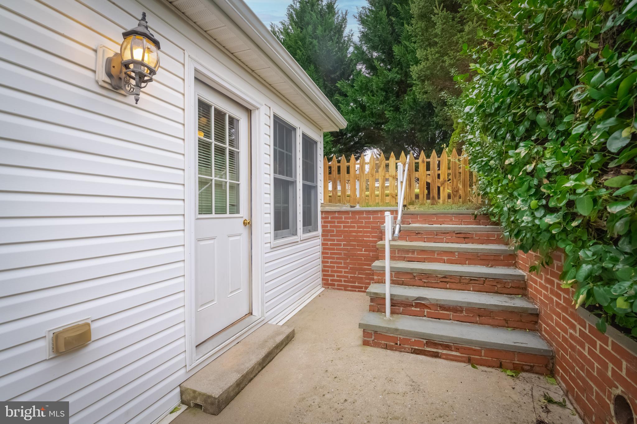 1805 Roland Avenue Towson, MD 21204 - Photo 40 of 46 Steps to fenced in rear yard from the kitchen