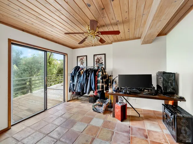 a bathroom with a sink a toilet and shower curtain