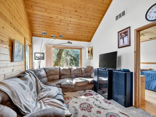 a bedroom with furniture and wooden floor