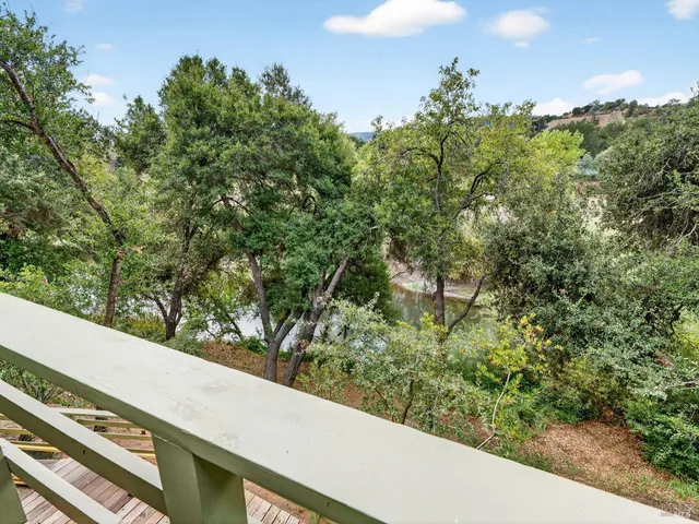 a view of a garden from a balcony