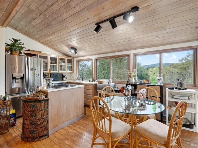 a view of a dining room with furniture window and outside view