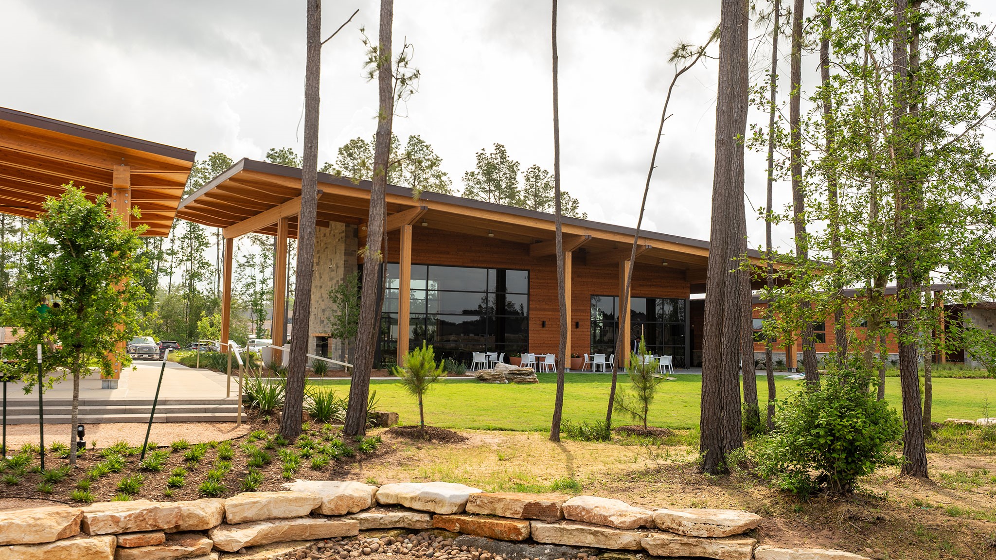 15683 Hoptree Hts Lane Conroe, TX 77302 - Photo 15 of 16 a view of a patio with table and chairs and wooden fence