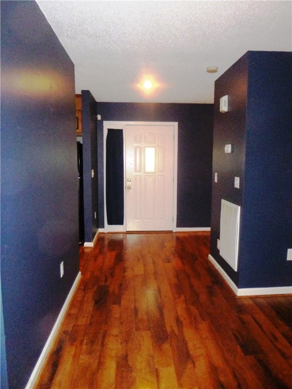 Wide Foyer with windowed door and side-light panel