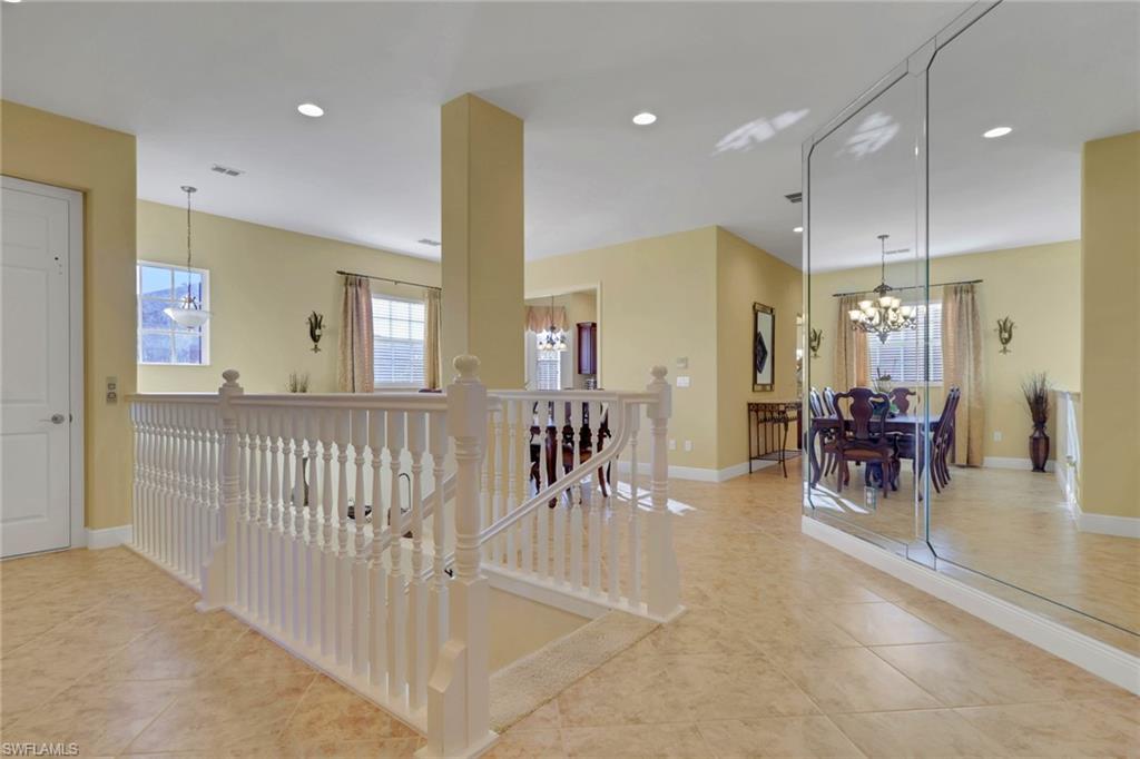 6397 Legacy Circle, Unit 2003 Naples, FL 34113 - Photo 4 of 26 a very nice looking dining room with a glass door shower