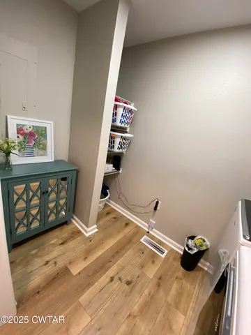 a bedroom with a bed and cabinets