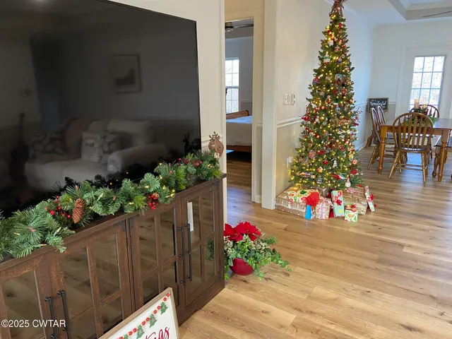 a front view of a house with flower pots