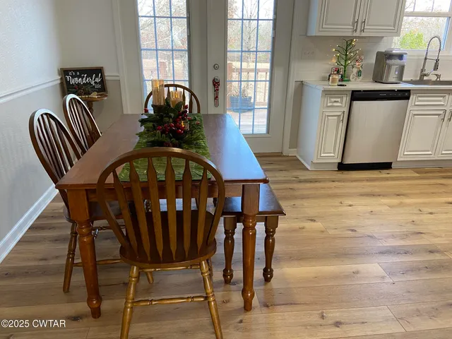a view of a dining room with furniture and window