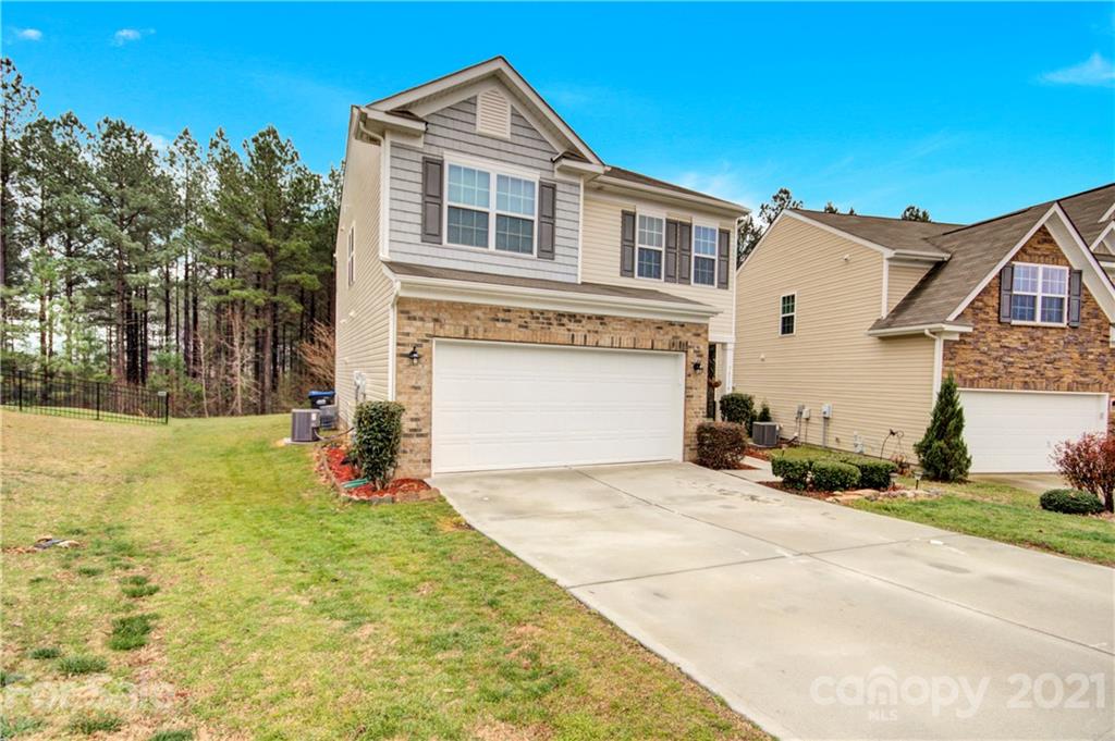 78174 Rillstone Drive Lancaster, SC 29720 - Photo 3 of 33 a front view of a house with a yard