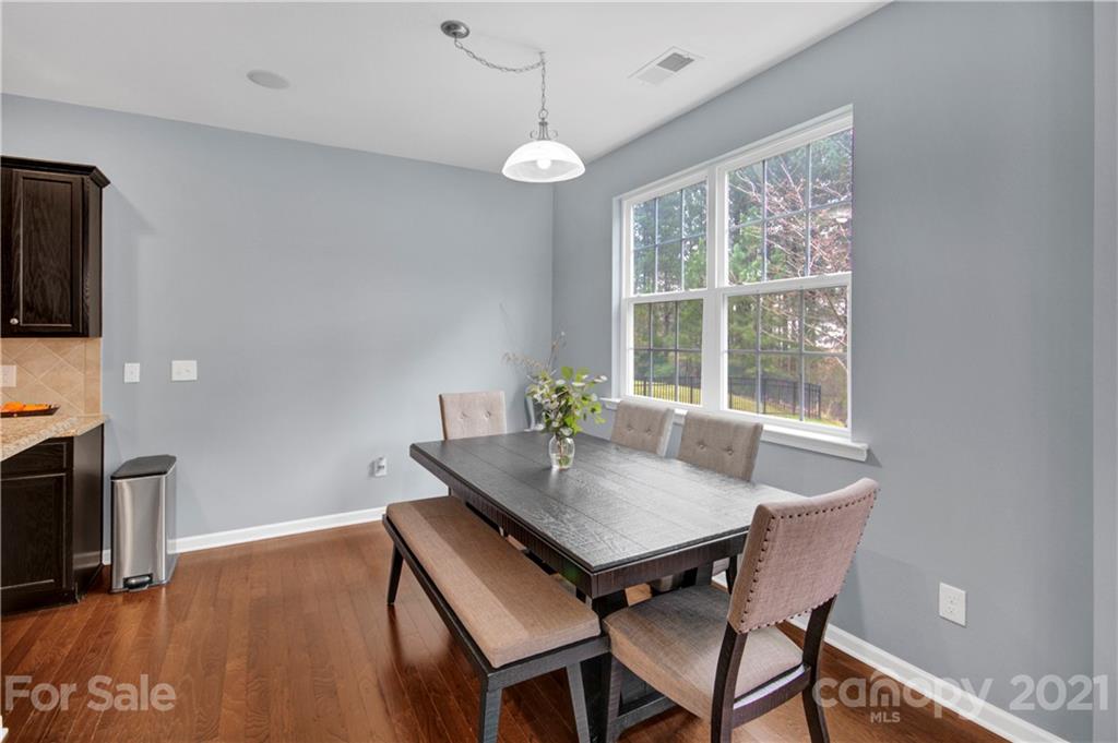 78174 Rillstone Drive Lancaster, SC 29720 - Photo 9 of 33 a view of a dining room with furniture window and wooden floor