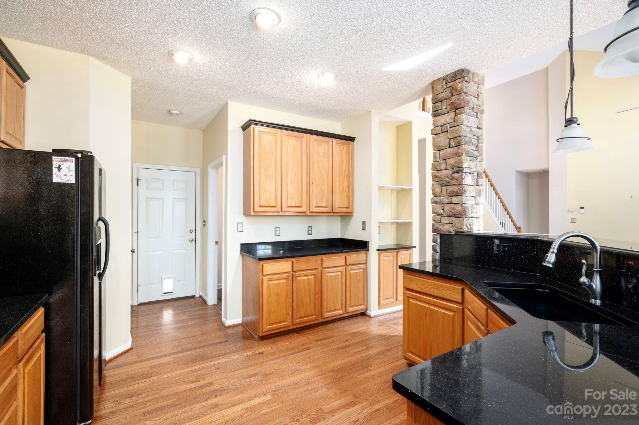 202 Walnut Crest Road Fletcher, NC 28732 - Photo 8 of 36 a kitchen with stainless steel appliances granite countertop a sink a stove and a refrigerator