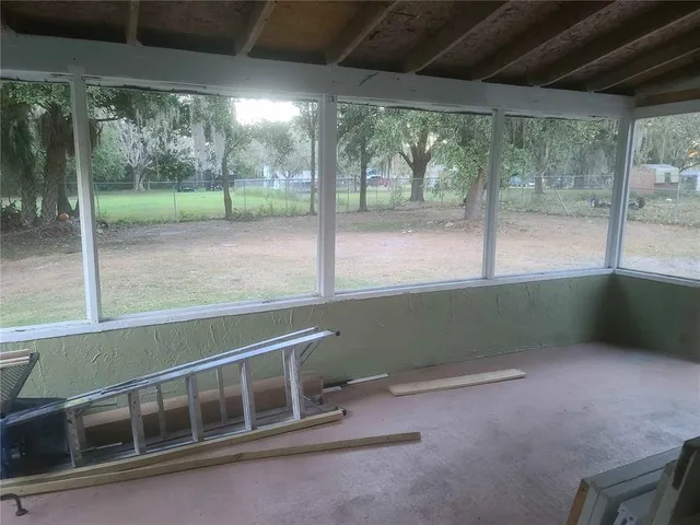 a view of an empty room with a balcony