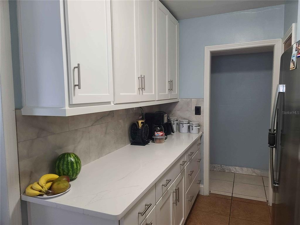1187 Varnado Road Groveland, FL 34736 - Photo 21 of 25 a kitchen with a sink a stove and window