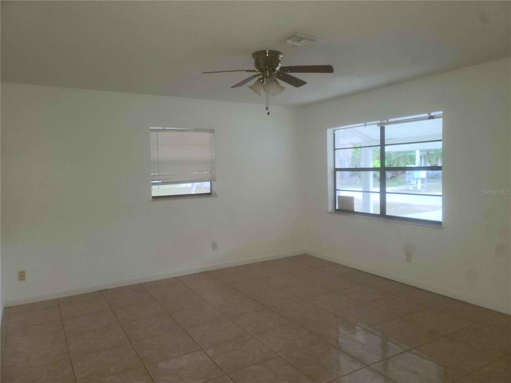 1187 Varnado Road Groveland, FL 34736 - Photo 4 of 25 an empty room with a window
