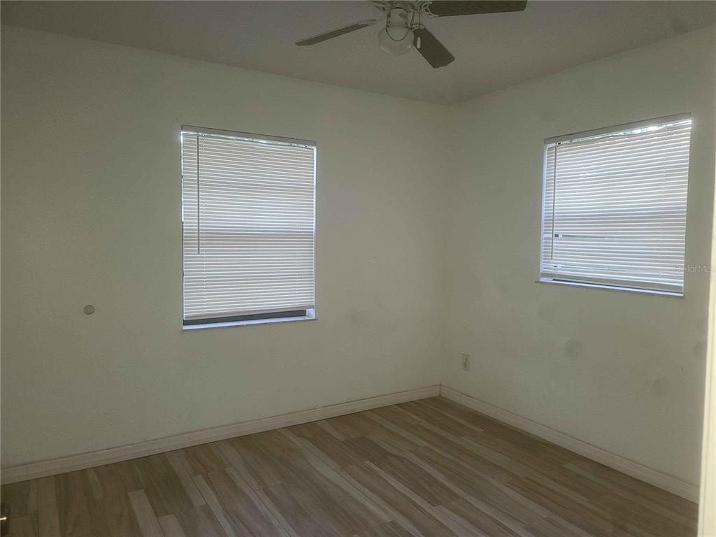 1187 Varnado Road Groveland, FL 34736 - Photo 9 of 25 an empty room with a window