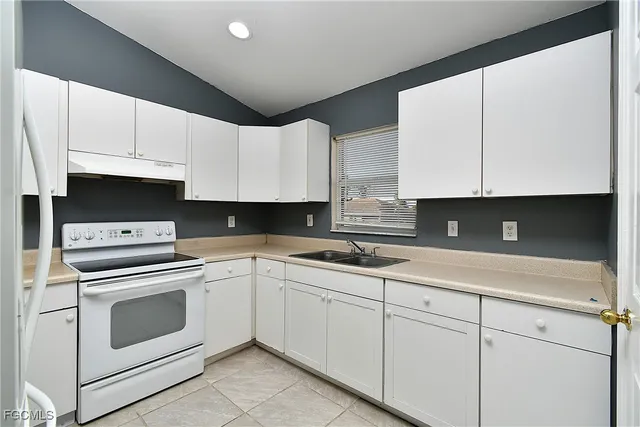 a view of washer and dryer with kitchen appliances