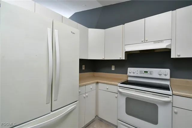 a view of an empty room with a bathroom