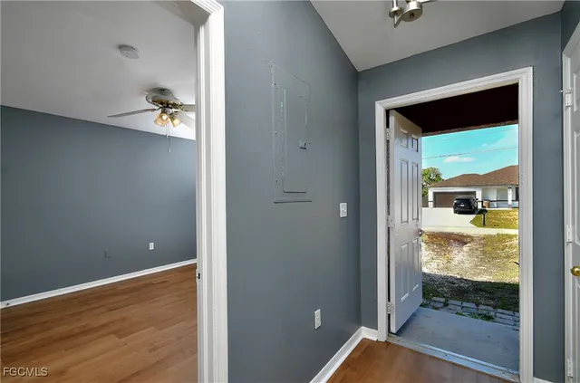 a view of an empty room with a window