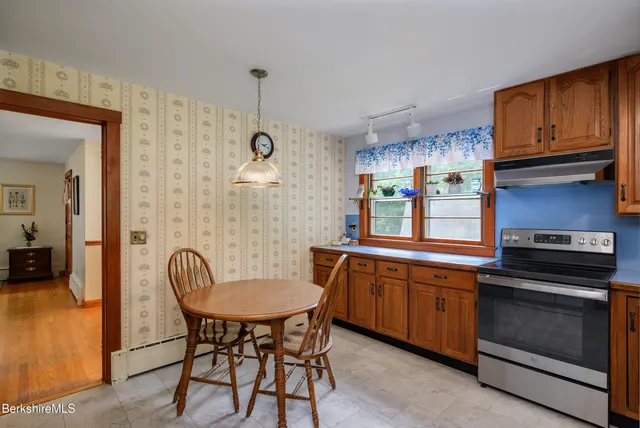 a kitchen with sink cabinets and appliances
