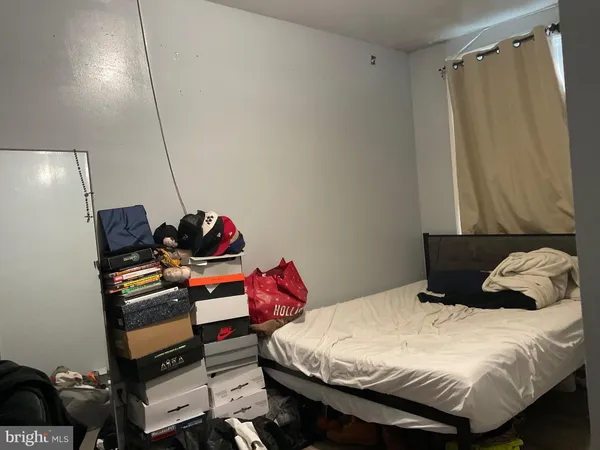 a bedroom with a bed and a closet