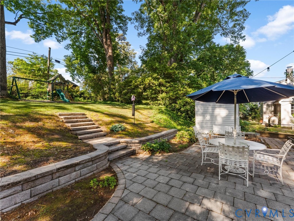 7505 Glebe Road Henrico, VA 23229 - Photo 39 of 42 Stone patio, retaining wall, and steps to the back