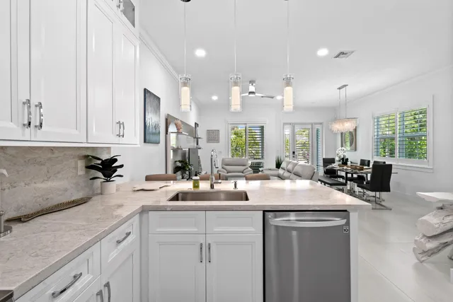 a view of hallway with a large window and wooden floor