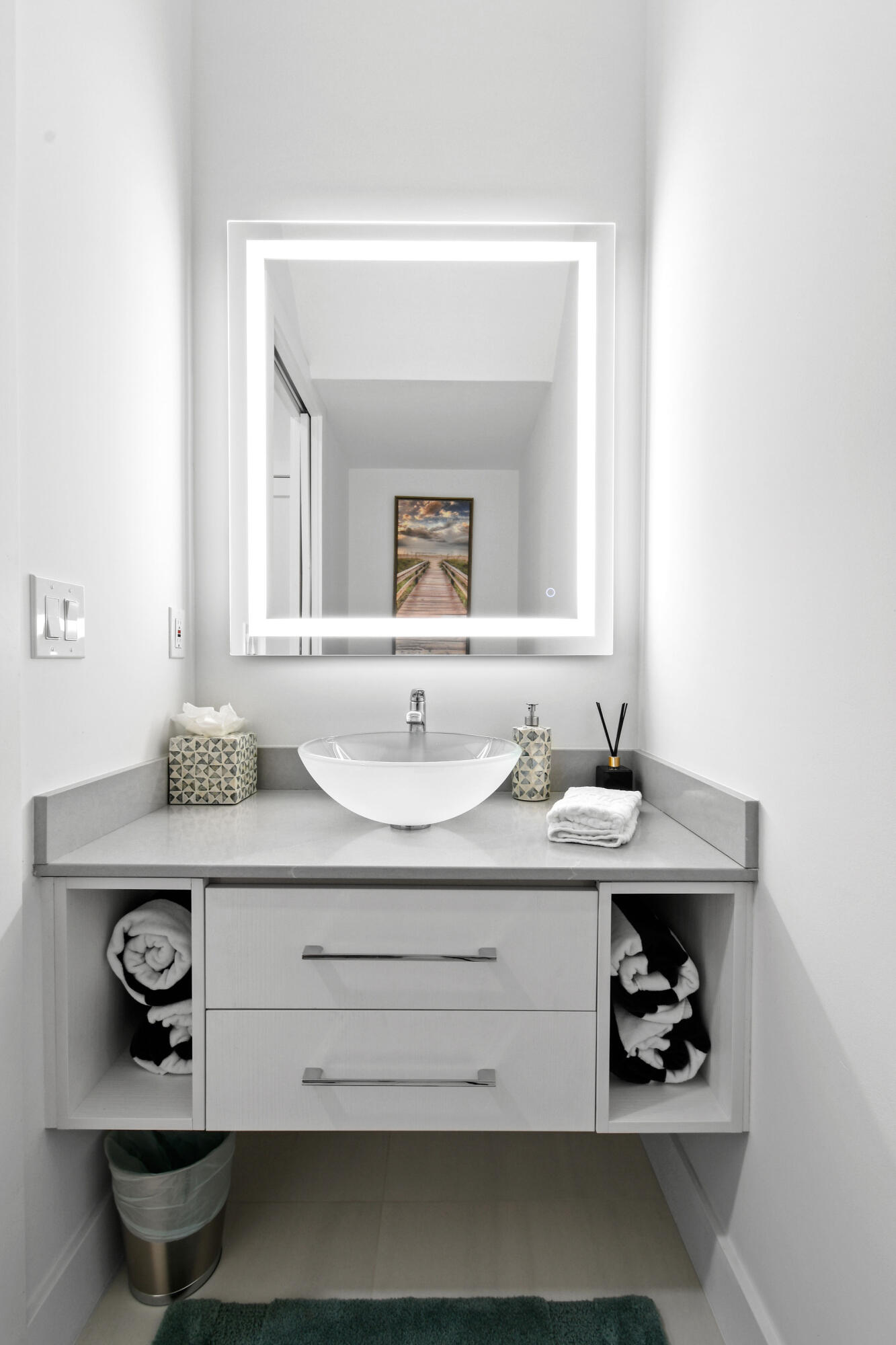 4650 Southeast Manatee Terrace Stuart, FL 34997 - Photo 16 of 95 a bathroom with a sink a mirror and vanity