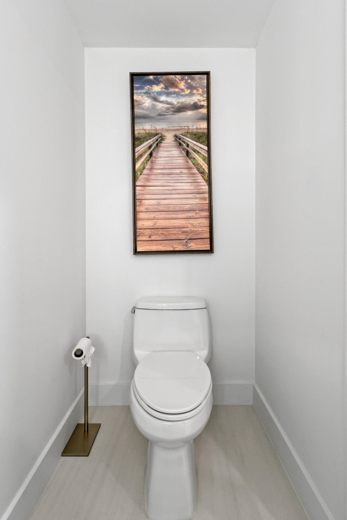 4650 Southeast Manatee Terrace Stuart, FL 34997 - Photo 17 of 95 a bathroom with a toilet and a window